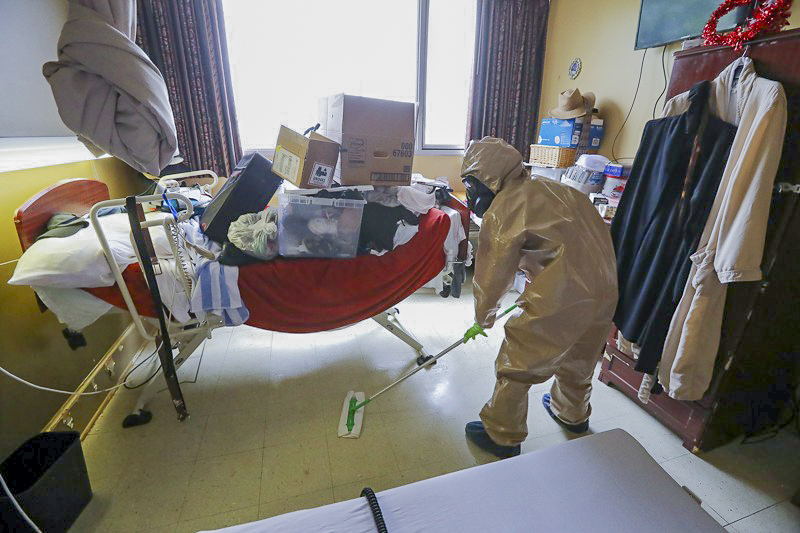 Georgia Army National Guard Spc. Markeyvia Talley, a sophomore marketing major at Brenau, decontaminates a room at a nursing home. (Photo courtesy of Markeyvia Talley)