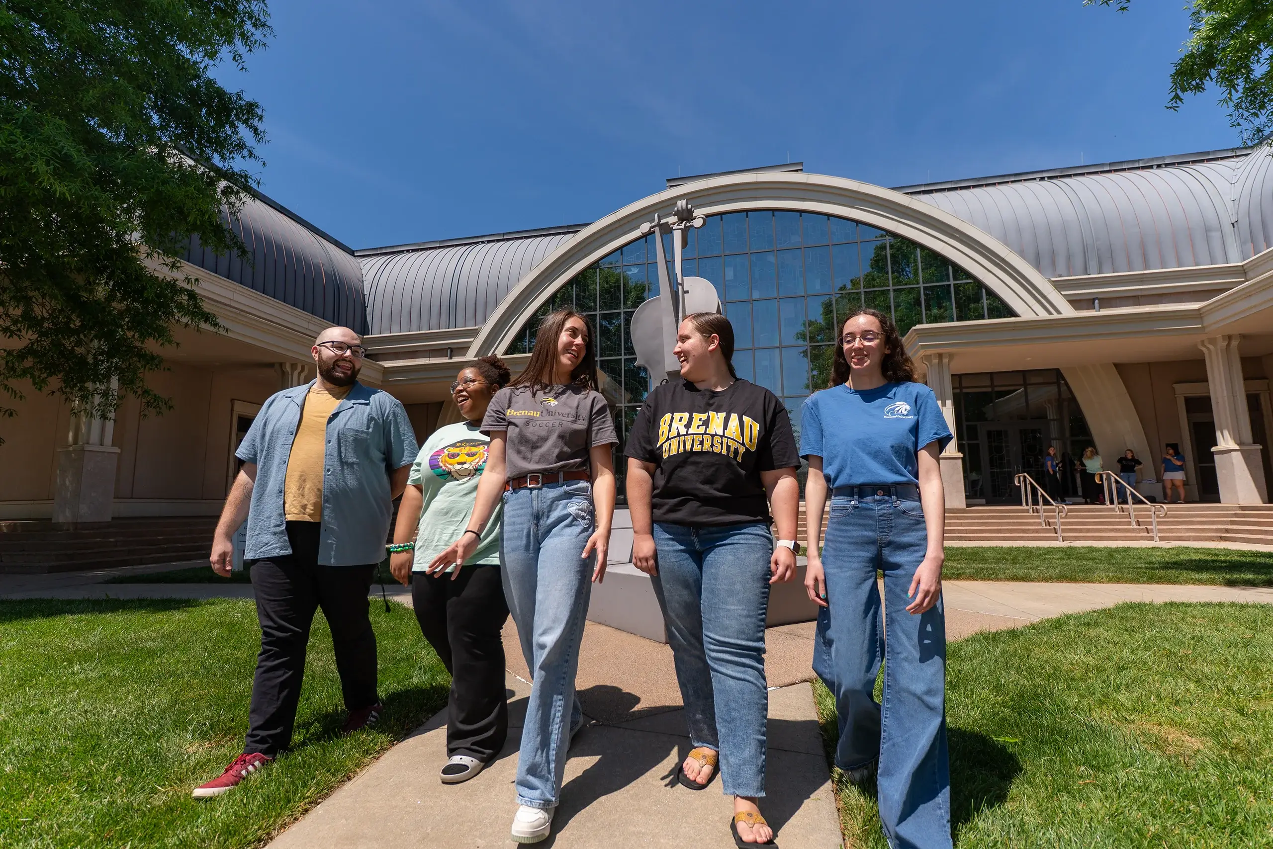 5 students walk outside of Burd Performing Arts Center